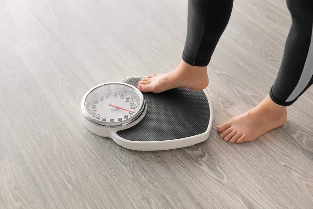 Person stepping on a scale