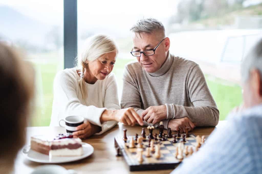 Man and woman playing a game of chess