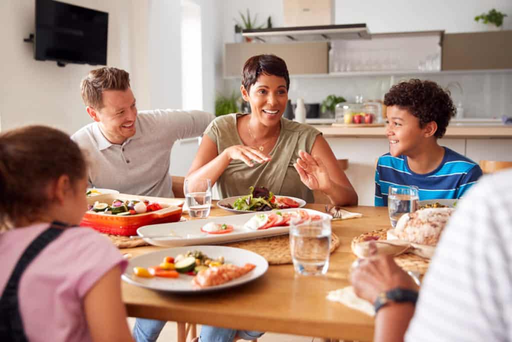 Image of family around a dining table