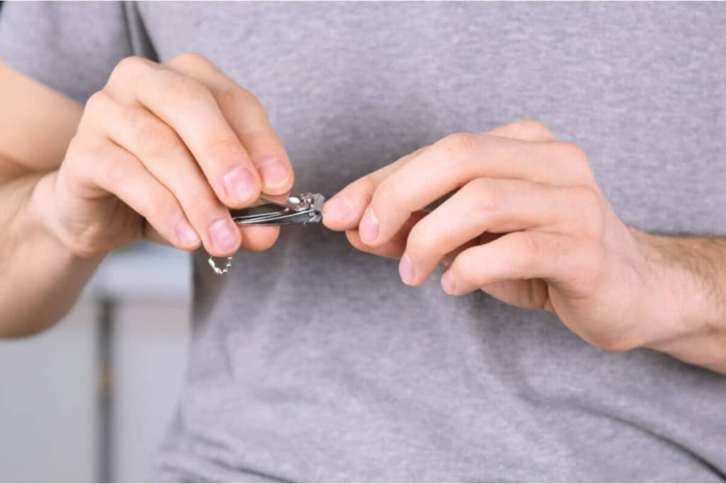 close up of person cutting their nails