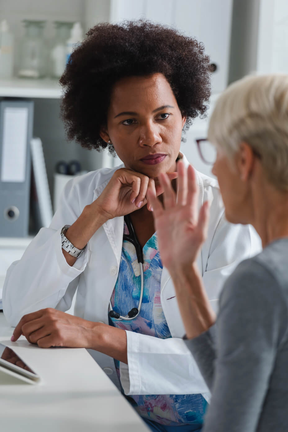 patient wellness doctor listening to a patient