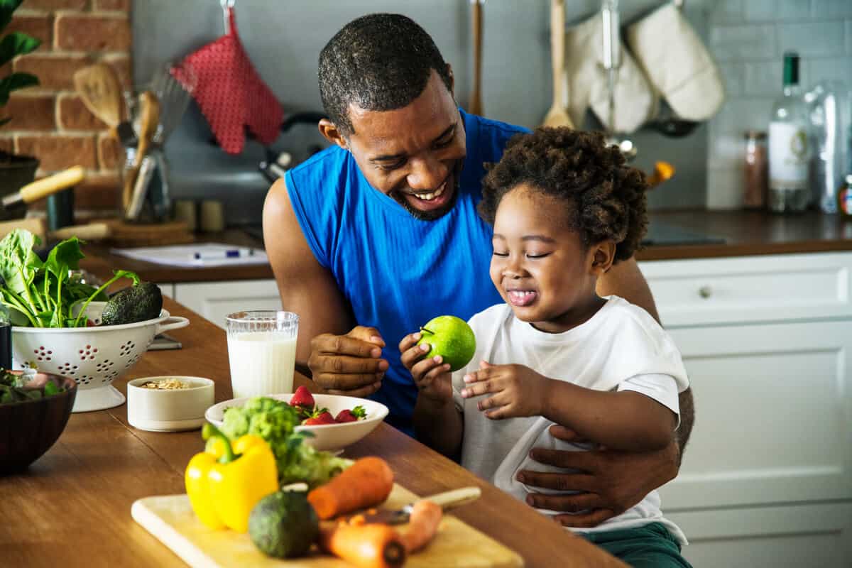 Man eating with a child 