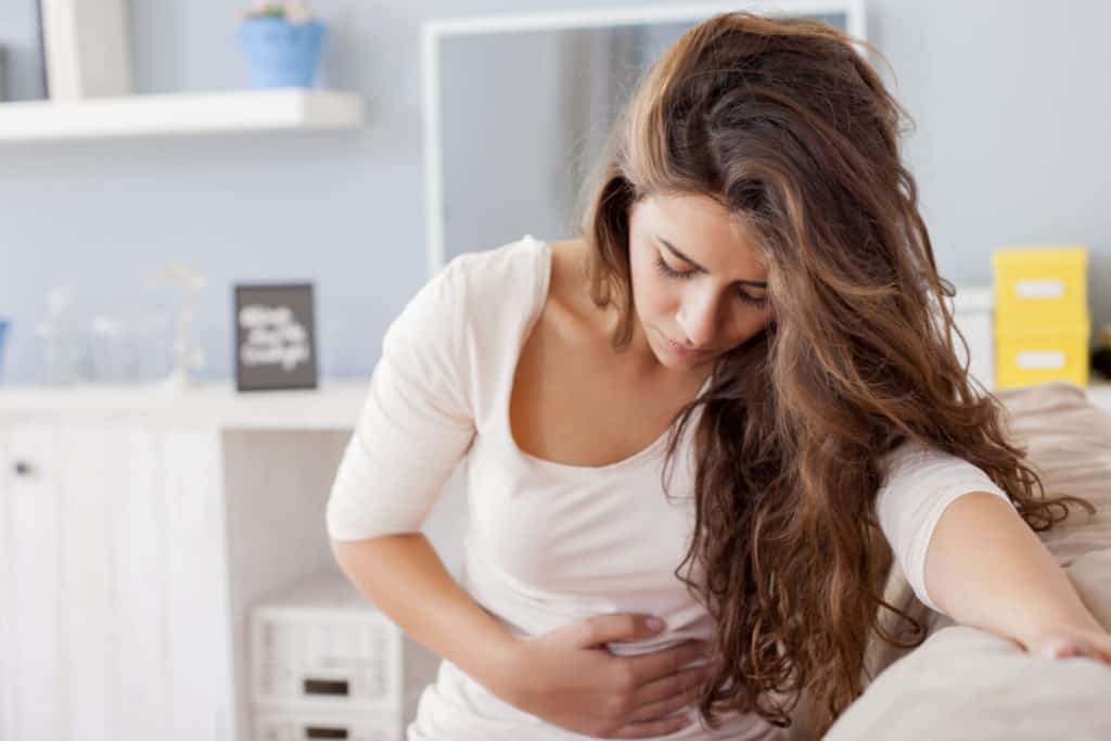 Woman holding abdomen