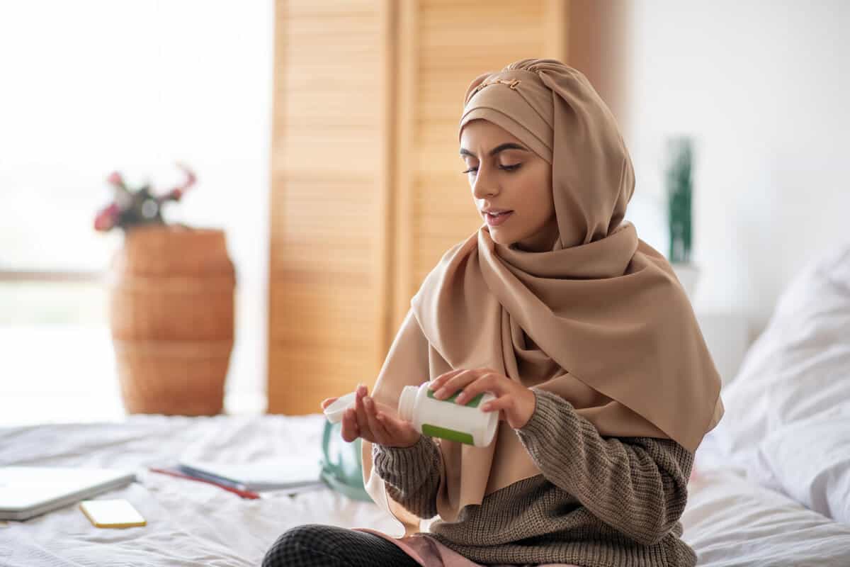 Woman taking supplements