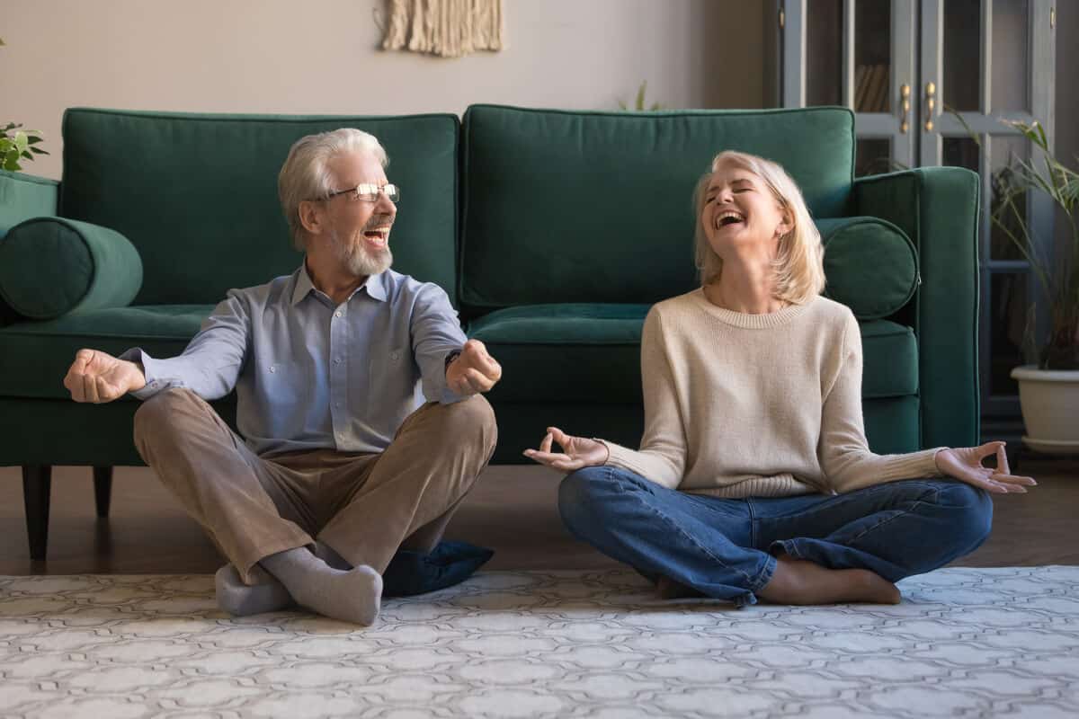 Two people doing laughter yoga 