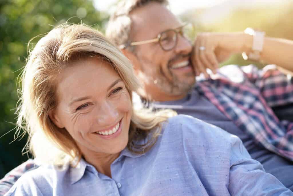 man and woman sitting together and smiling