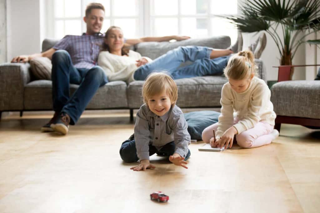 family all together playing in living room