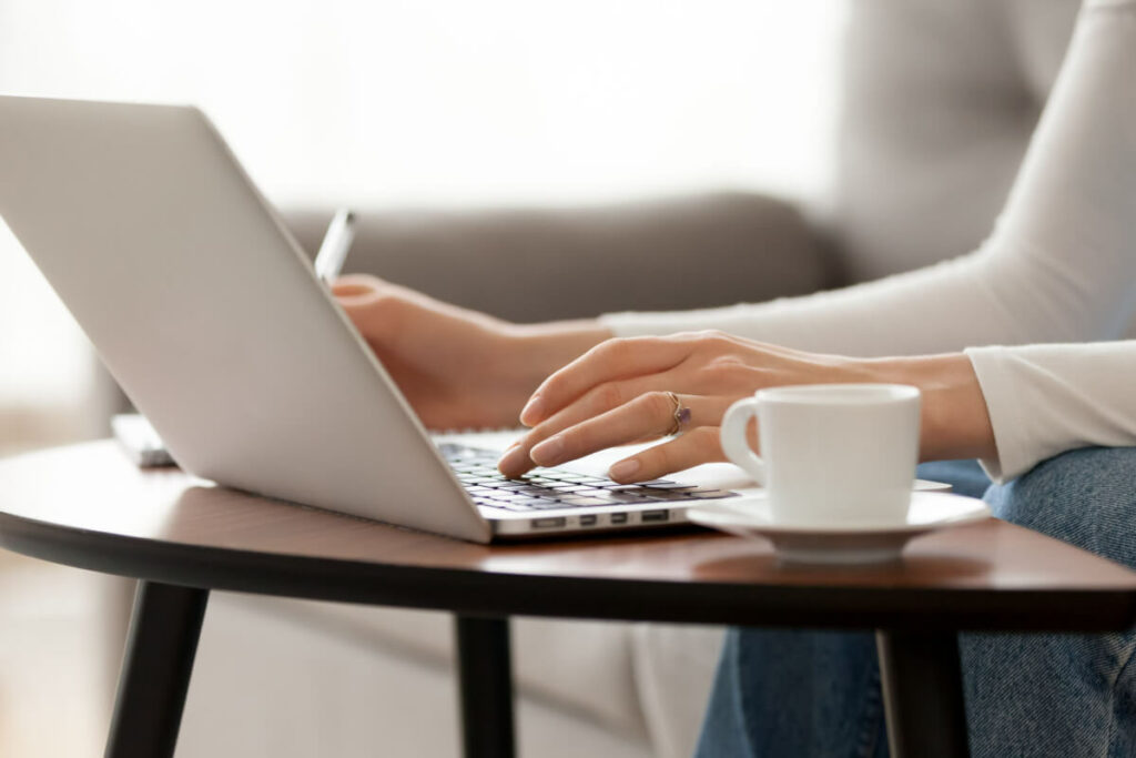 person typing on a laptop