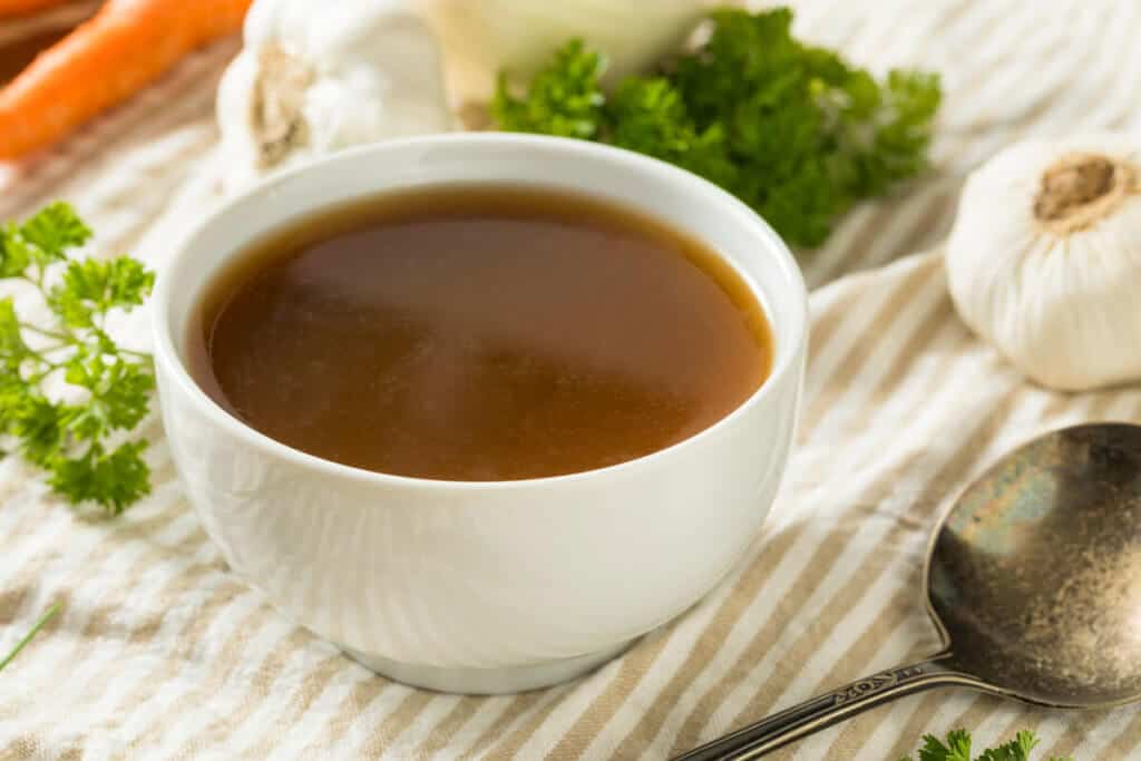 Homemade beef bone broth in a bowl