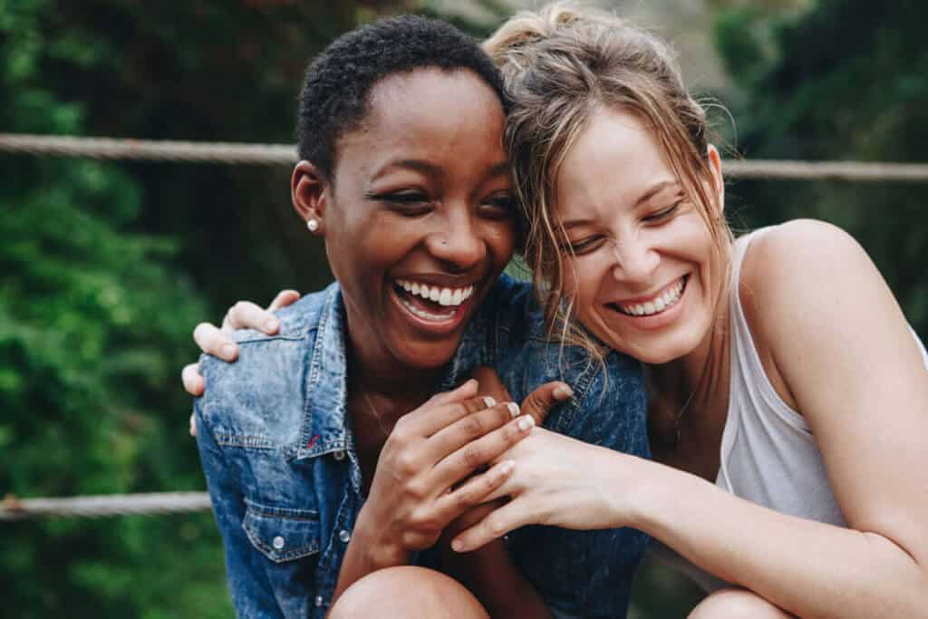 two women laughing together