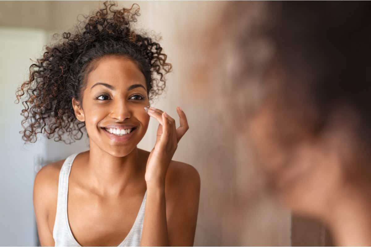 Turmeric woman looking in a mirror