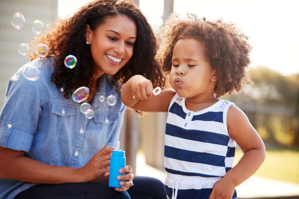 Child blowing bubbles