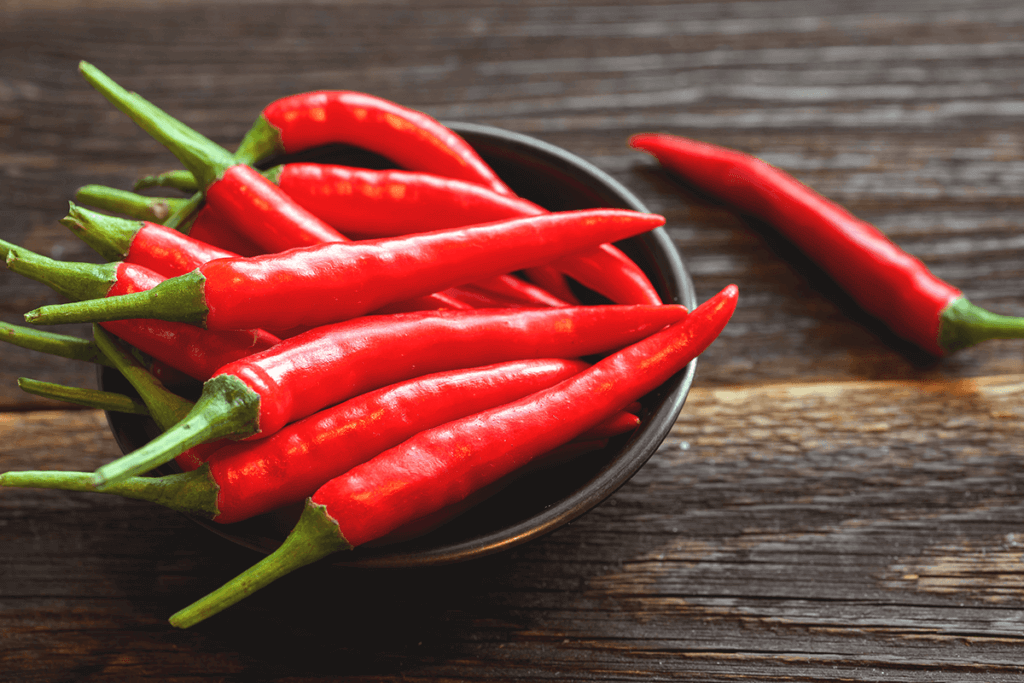 hot peppers in a bowl on a table