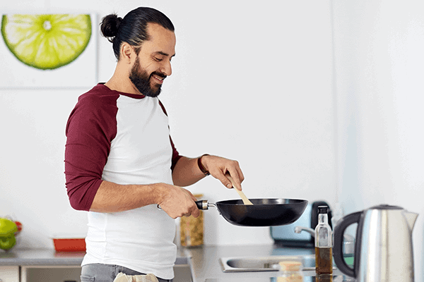 Man cooking with oil