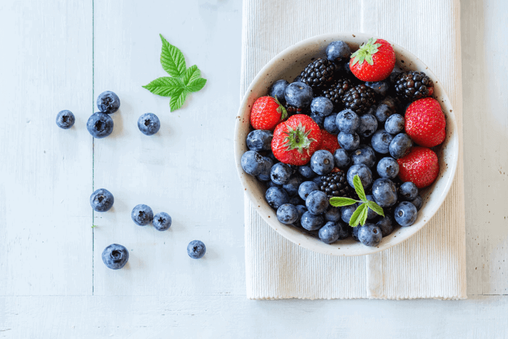 bowl full of berries on a table